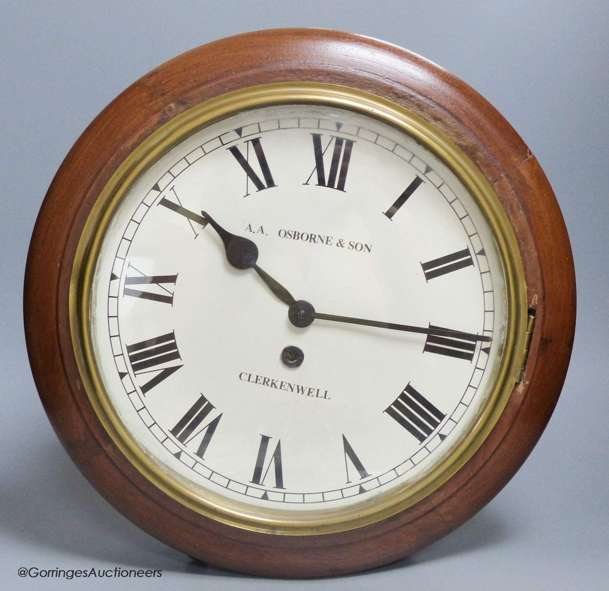 An early 20th century mahogany cased wall clock, A.A. Osborne & Son, diameter 40cm, American movement